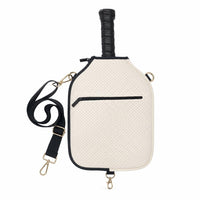 Cream CARRY neoprene cover with black trim and black strap, with a paddle handle sticking out of the top