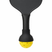 SCOOP ball pickup tool fitted on the end of a paddle handle with a yellow ball, on a white background